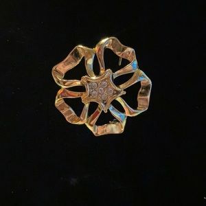 Vintage Danecroft flower rhinestone and gold toned brooch